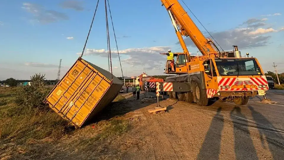Truck crane operators on work placement: a container, a module and a yacht